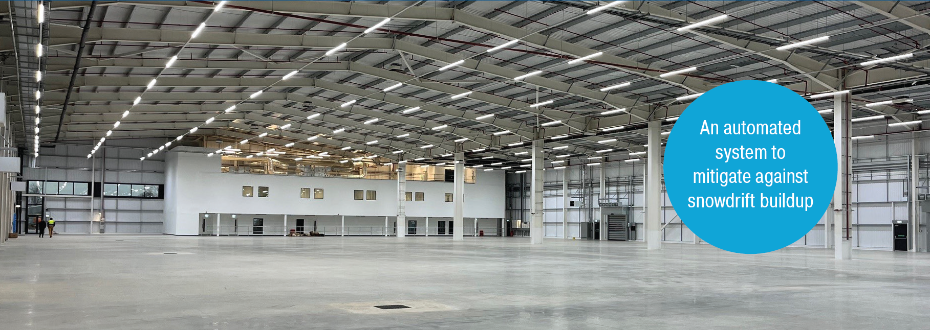 Snowdrift mitigation system installed on a commercial roof